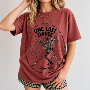 Two skeletons dancing tango, one in a veil, in a starry frame with the text One Last Dance Austin 2026