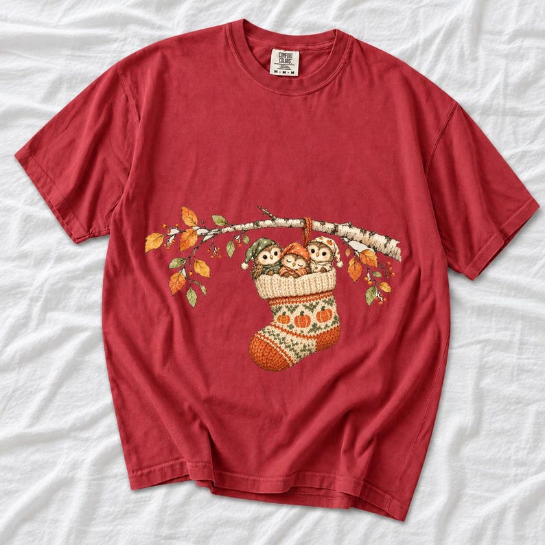 Three watercolor owlets in pajamas and nightcaps tucked into a knitted stocking on a birch branch, one asleep