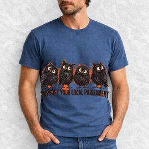 Four fluffy big-eyed black owls in a row with the text "Support Your Local Parliament"