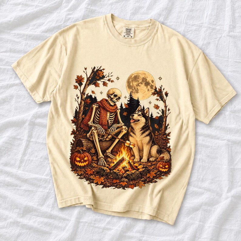 A skeleton in a scarf roasting marshmallows by a campfire beside a husky in an autumn forest under a full moon