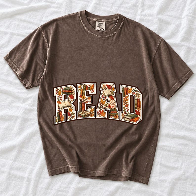 Arched varsity word READ filled with tiny books and autumn leaves in cream, rust and mustard