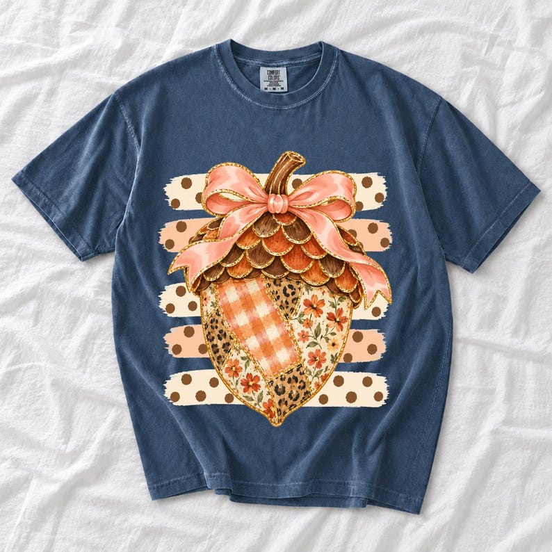 Giant patchwork acorn with a pink satin bow made of plaid, leopard and floral fabric on polka-dot stripes
