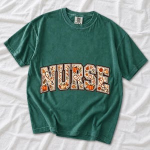 Arched varsity word NURSE filled with autumn leaves, stethoscopes and pumpkins in cream, rust and mustard