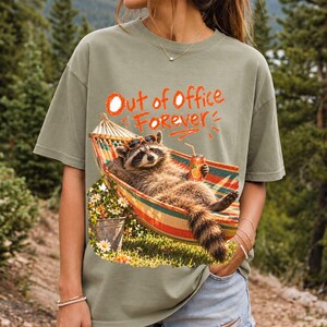Raccoon relaxing in a hammock with a soda can and sunglasses, 90s film photo style, text "Out of Office Forever"