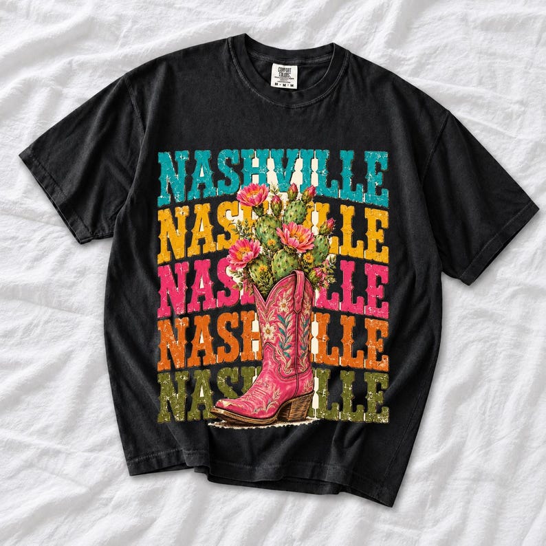Pink embroidered cowboy boot with blooming cactus over a five-line stacked NASHVILLE word in retro colors