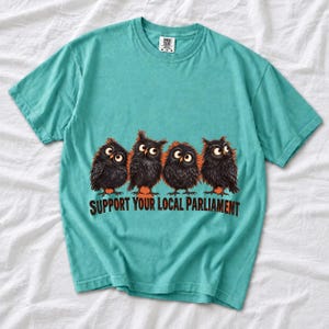 Four fluffy big-eyed black owls in a row with the text "Support Your Local Parliament"