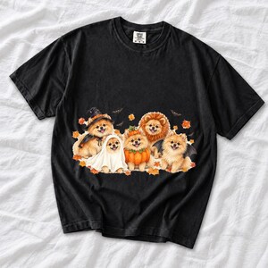 Five fluffy watercolor pomeranians in Halloween costumes with autumn leaves and bats