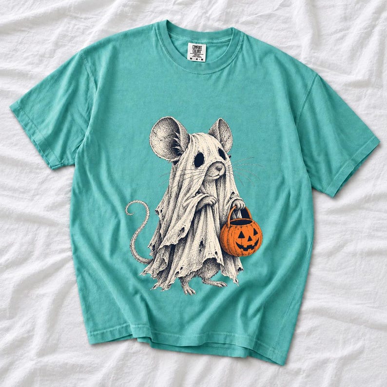 Etched pen illustration of a small mouse in a sheet ghost costume holding a candy bucket, bone white with orange accent