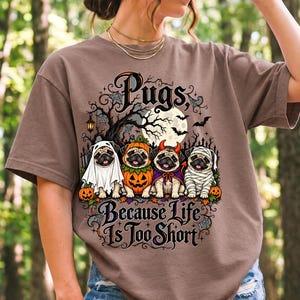 Four pugs in ghost, pumpkin, devil and mummy costumes under a spooky tree with text Pugs, Because Life Is Too Short
