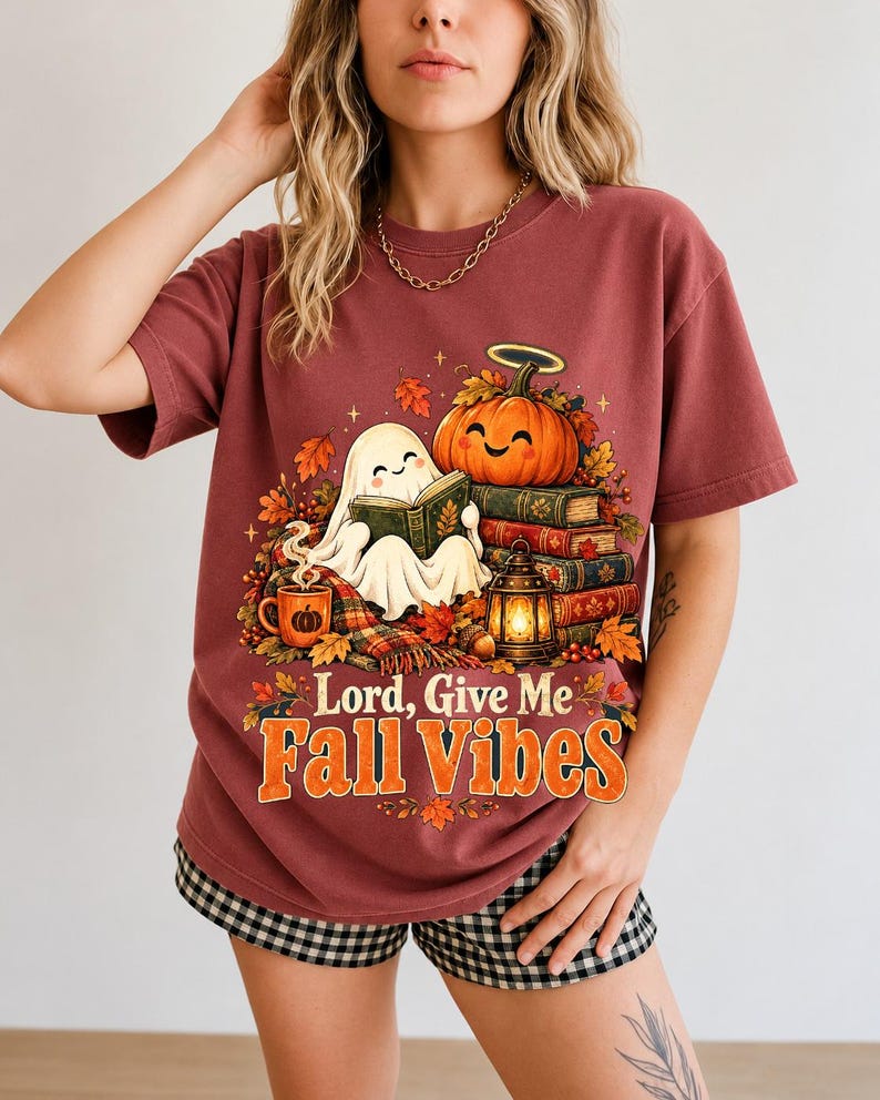 Smiling pumpkin with a halo beside a stack of books and a lantern, text "Lord, Give Me Fall Vibes", retro fall illustration