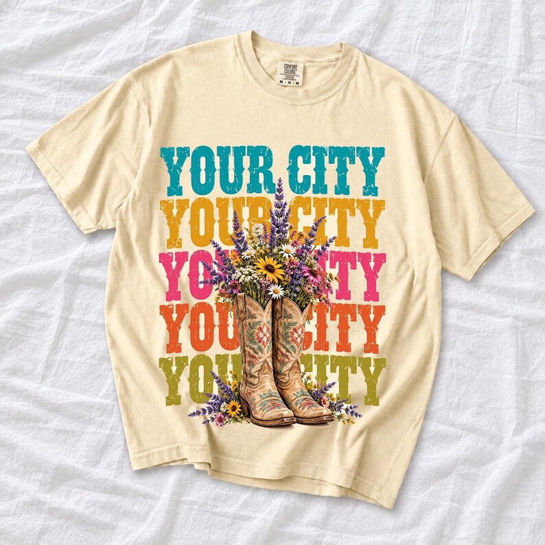 Tan cowboy boots with lavender and wildflowers over a five-line stacked personalized city word in retro colors