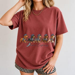 Illustrated dachshunds in conductor hats lined up like a train, text Doxie Express