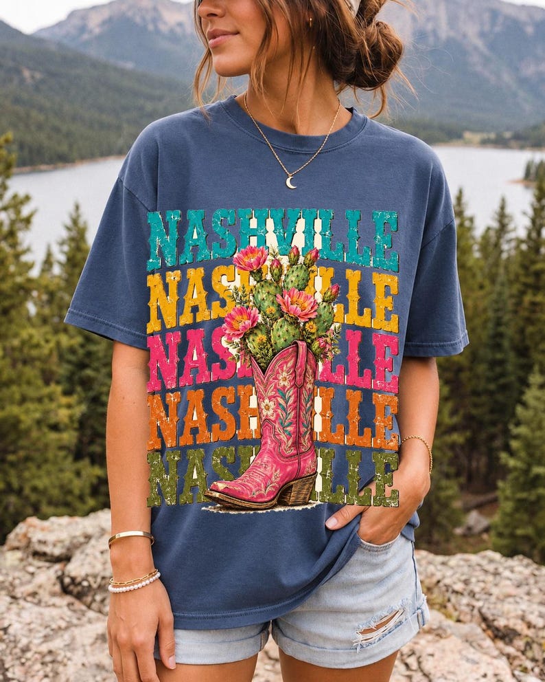 Pink embroidered cowboy boot with blooming cactus over a five-line stacked NASHVILLE word in retro colors