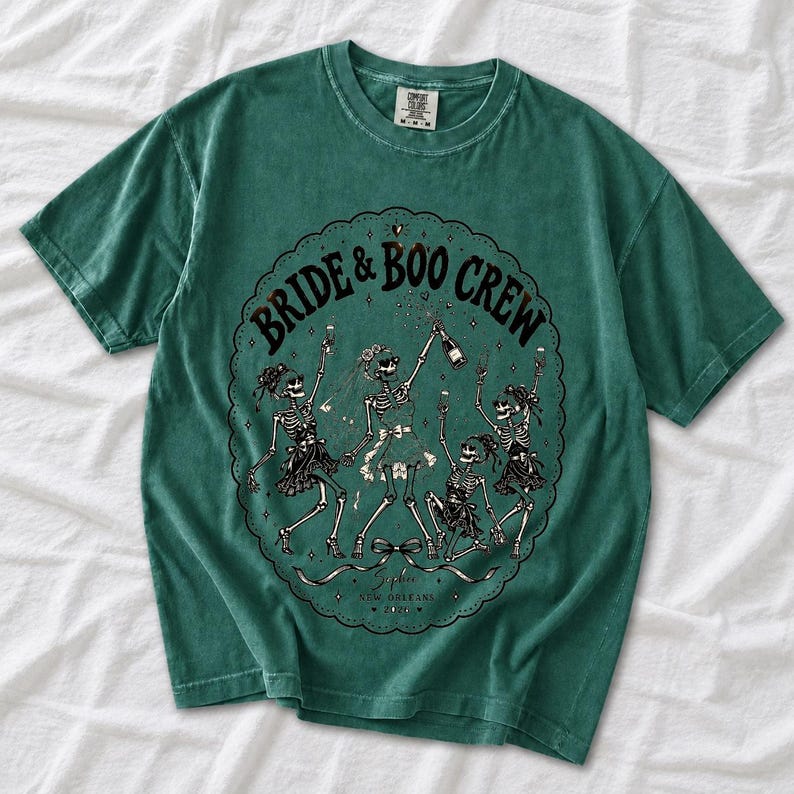 Skeleton bride popping champagne with cheering skeleton bridesmaids and the text Bride & Boo Crew