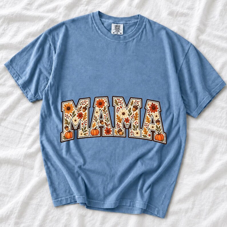 Arched varsity word MAMA filled with fall flowers and acorns in cream, rust and mustard