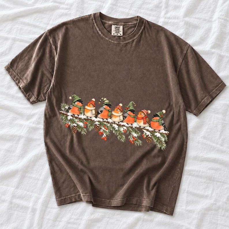 Watercolor bullfinches and robins in elf hats and scarves on a snowy pine branch