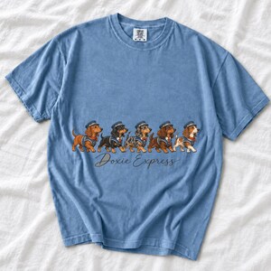 Illustrated dachshunds in conductor hats lined up like a train, text Doxie Express