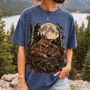 Fox family curled on a rock under a huge full moon among birch trees, dark realistic woodland illustration