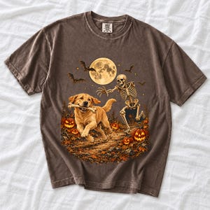 A skeleton chasing a golden labrador that stole its arm bone under a full moon with jack o lanterns and bats
