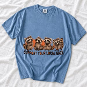 Four raccoons in a row with the text "Support Your Local Gaze"