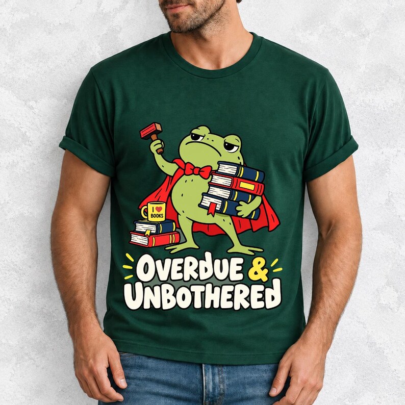 Grumpy cartoon frog librarian holding a stamp and a stack of books with the text Overdue & Unbothered
