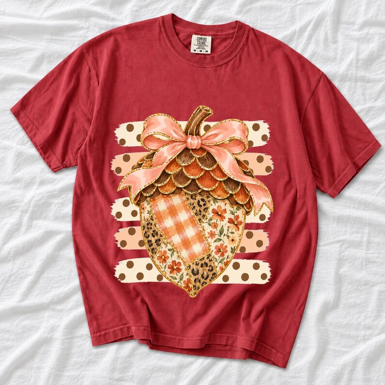 Giant patchwork acorn with a pink satin bow made of plaid, leopard and floral fabric on polka-dot stripes