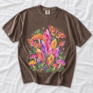 Retro 70s psychedelic glitter crystal cluster with moths and small frogs in pink, mustard, violet and mint