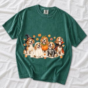Five watercolor beagles in witch, ghost, pumpkin, skeleton and vampire costumes with floating autumn leaves