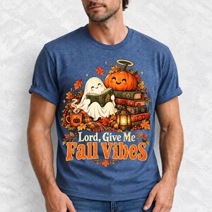 Smiling pumpkin with a halo beside a stack of books and a lantern, text "Lord, Give Me Fall Vibes", retro fall illustration