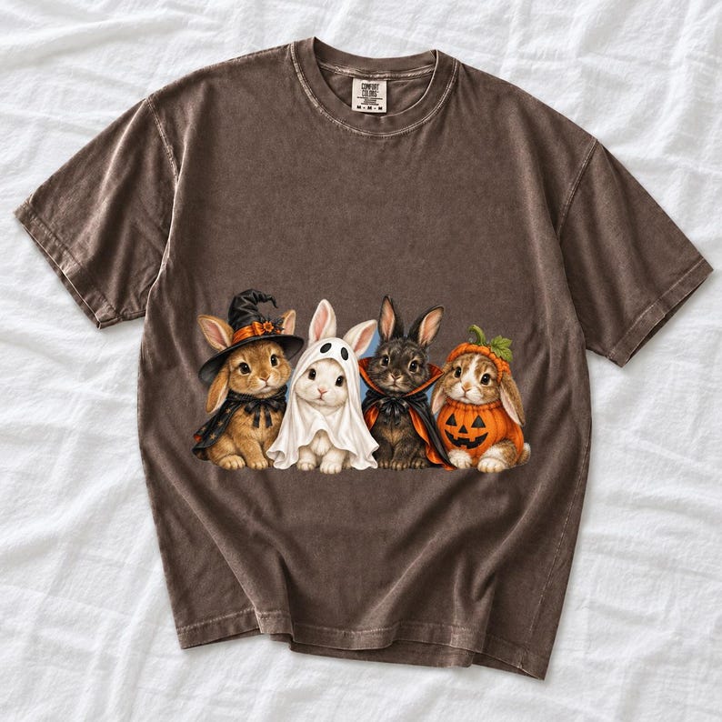 Realistic illustration of four bunnies in witch, ghost, vampire cape and pumpkin costumes in a row