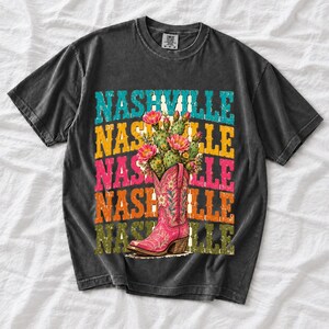 Pink embroidered cowboy boot with blooming cactus over a five-line stacked NASHVILLE word in retro colors