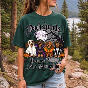 Four dachshunds in Halloween costumes under a spooky tree with text Dachshunds, Because People Are Exhausting
