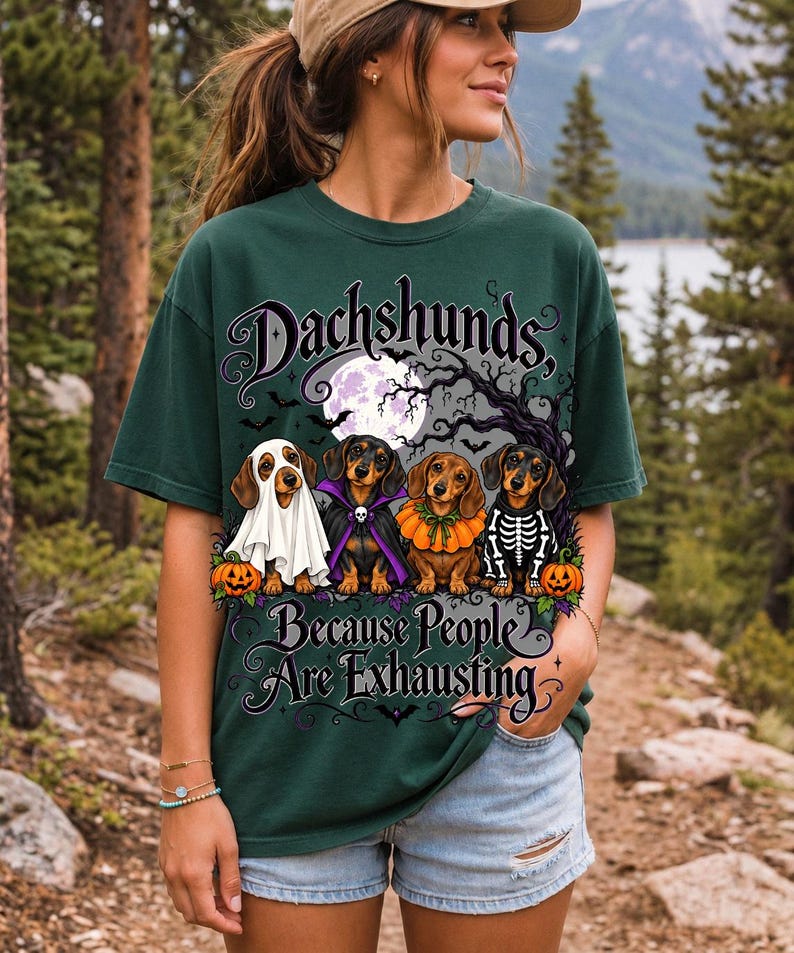 Four dachshunds in Halloween costumes under a spooky tree with text Dachshunds, Because People Are Exhausting