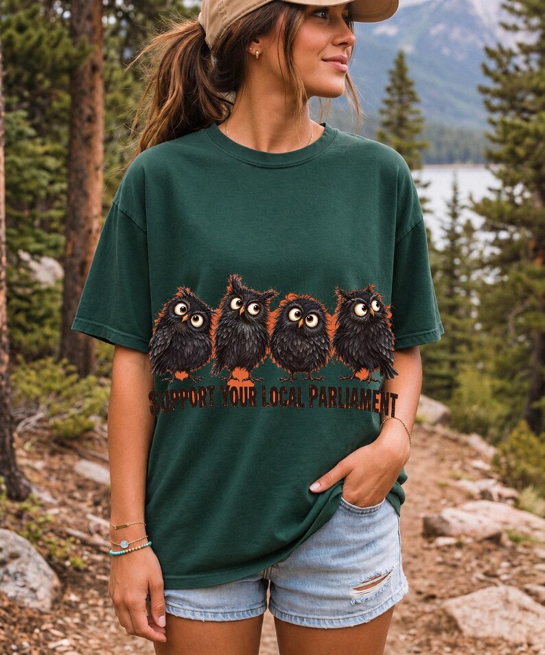 Four fluffy big-eyed black owls in a row with the text "Support Your Local Parliament"