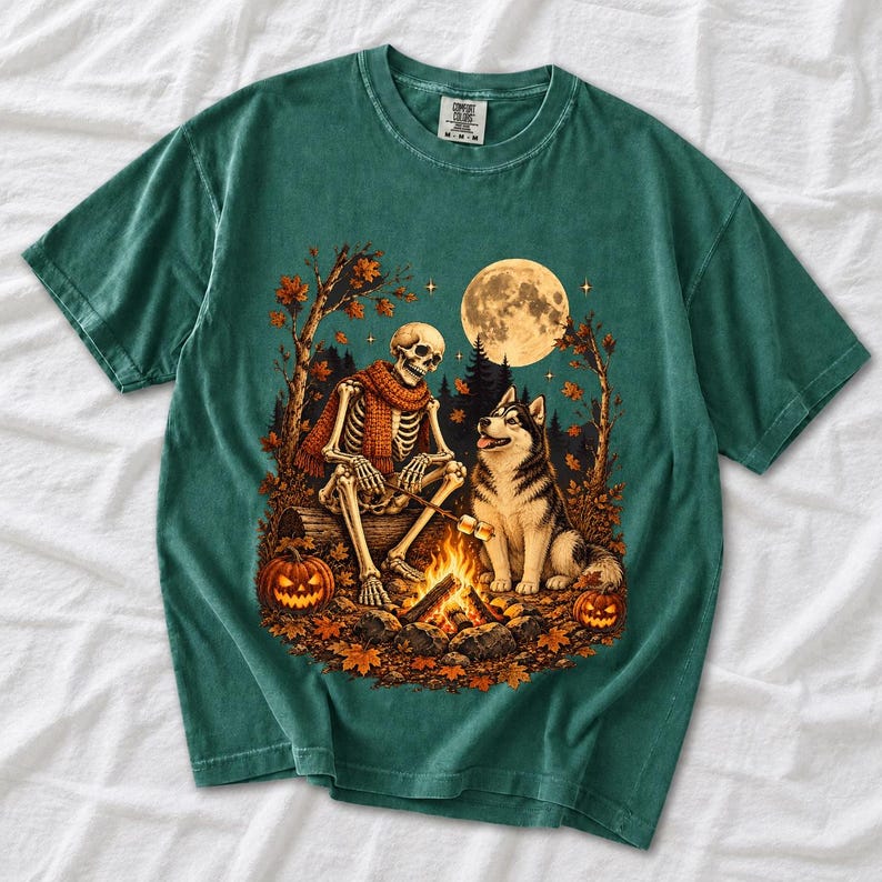A skeleton in a scarf roasting marshmallows by a campfire beside a husky in an autumn forest under a full moon