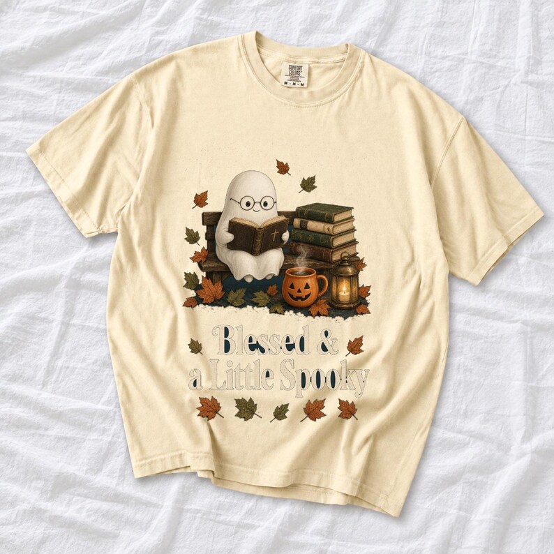 Cute ghost with glasses reading a Bible with a candle and mug, text "Blessed & a Little Spooky", retro fall illustration
