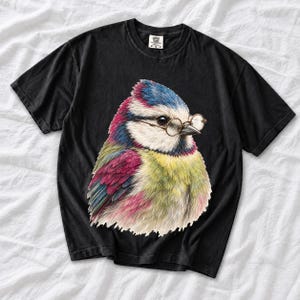 Colored-pencil blue tit bird wearing tiny round reading glasses, funny birdwatcher t-shirt illustration