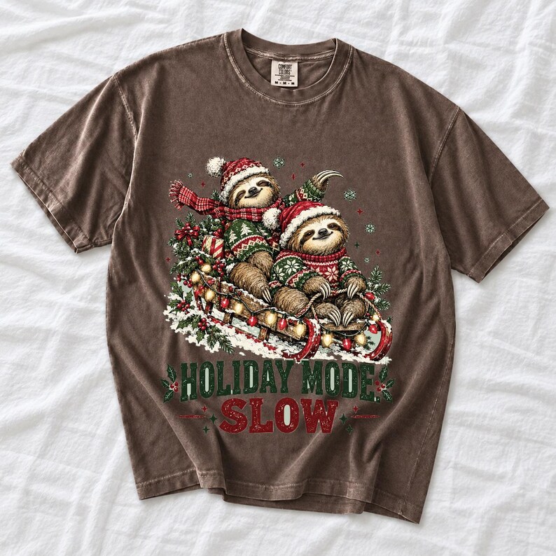 Two sloths in ugly sweaters riding a sled with lights and the text Holiday Mode: Slow