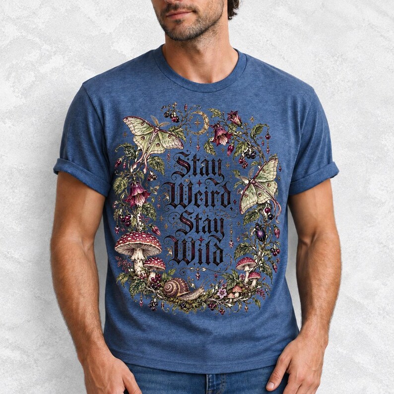 Victorian-style wreath of nightshade, luna moths and toadstools around the words "Stay Weird, Stay Wild"