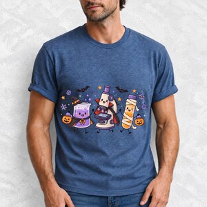 Kawaii beaker, microscope and test tube with faces in Halloween costumes, pastel purple and orange