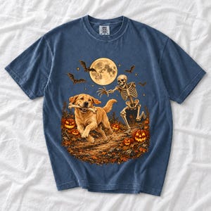 A skeleton chasing a golden labrador that stole its arm bone under a full moon with jack o lanterns and bats