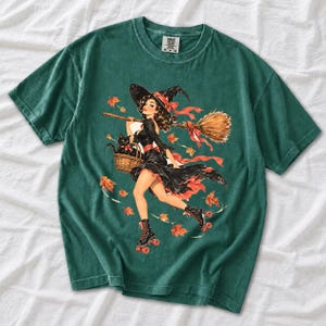 Retro 1950s pin-up witch on roller skates with a broom and a cat in a basket, autumn leaves