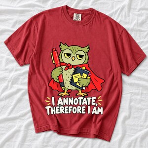 Cartoon owl in a cape holding a giant red pen and sticky notes with the text I Annotate, Therefore I Am
