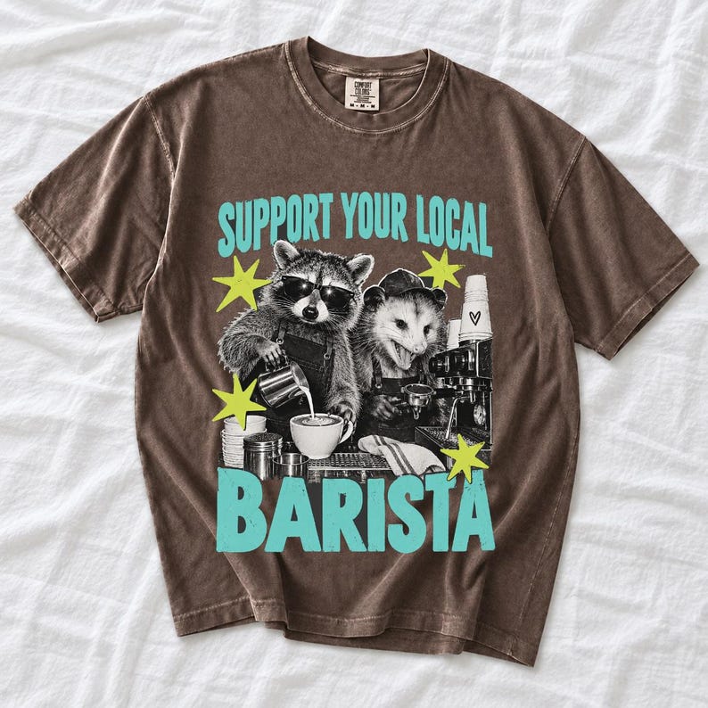 Raccoon and opossum behind an espresso machine, zine collage, text "Support Your Local Barista"