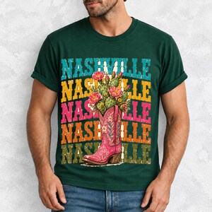 Pink embroidered cowboy boot with blooming cactus over a five-line stacked NASHVILLE word in retro colors