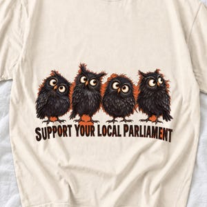 Four fluffy big-eyed black owls in a row with the text "Support Your Local Parliament"