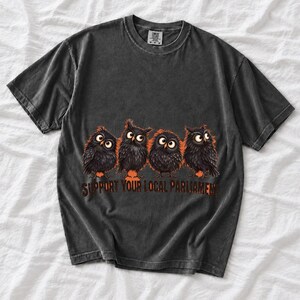 Four fluffy big-eyed black owls in a row with the text "Support Your Local Parliament"