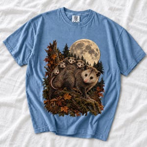 Mother opossum with babies on her back under a full moon and autumn leaves, dark realistic woodland illustration