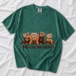Four ferrets in tiny ties in a row with the text "Mind Your Own Business"