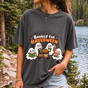 Four kawaii ghosts with books, a library cart and bookmarks, text Booked for Halloween